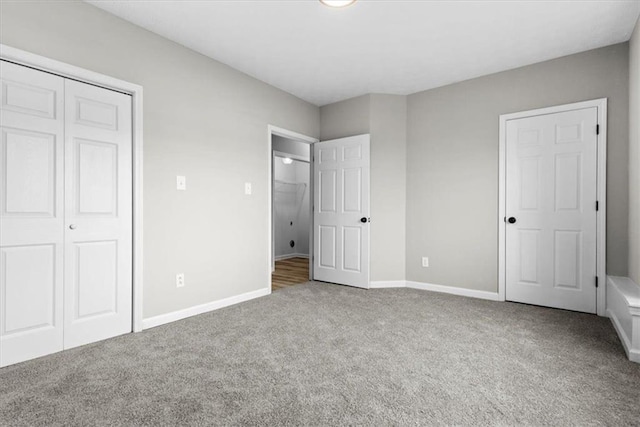 unfurnished bedroom with a closet and carpet