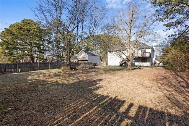 view of yard with a wooden deck