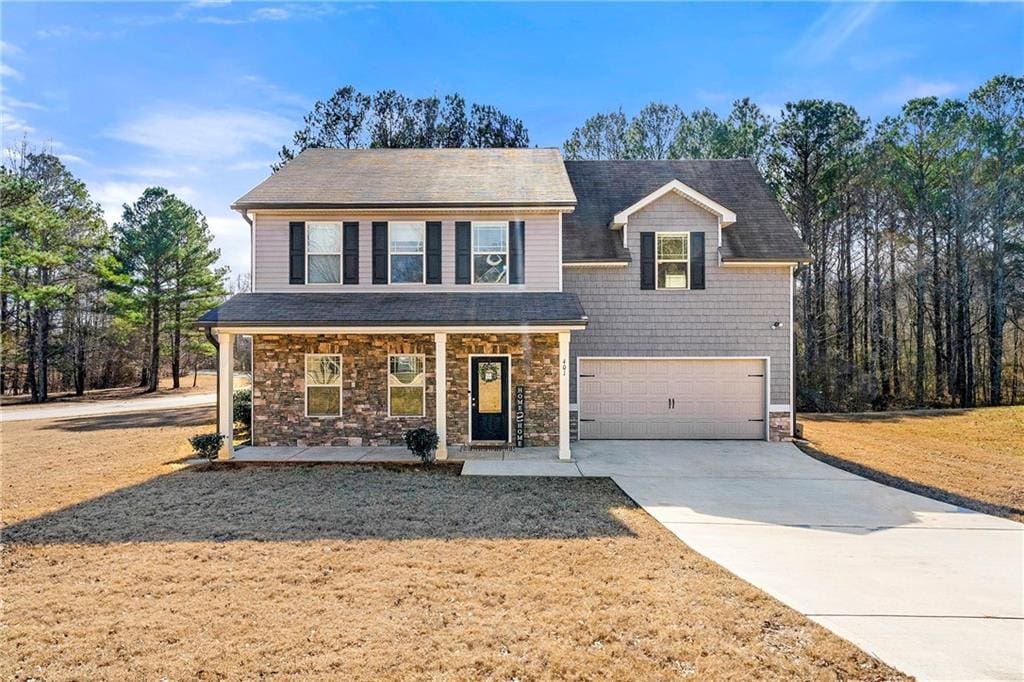 view of front of home with a garage and covered porch