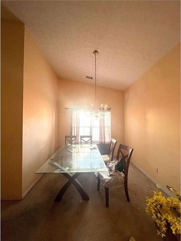 unfurnished dining area featuring carpet flooring, lofted ceiling, a chandelier, and a textured ceiling