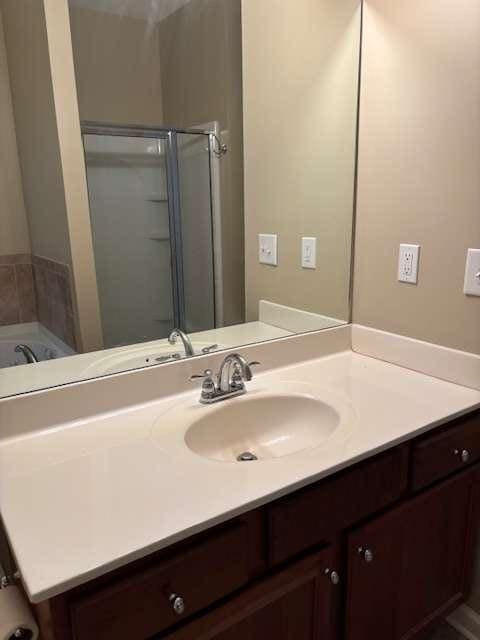 1629 Marsanne Ter, Kennesaw, GA 30152 - full bathroom featuring vanity, a bath, and a shower stall
