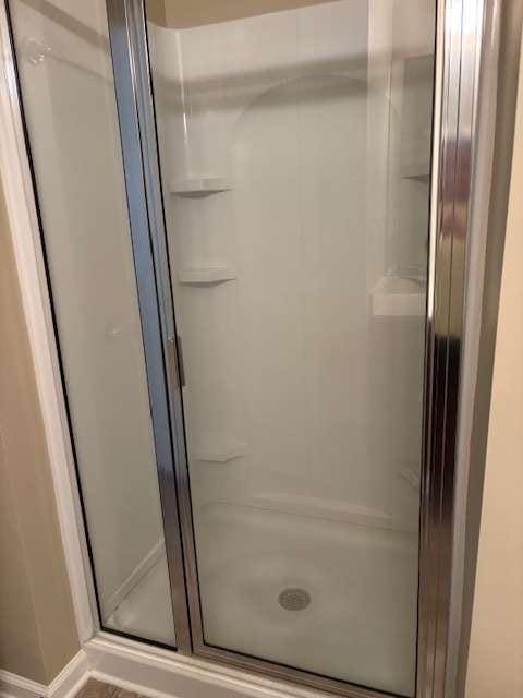 1629 Marsanne Ter, Kennesaw, GA 30152 - full bath featuring a shower stall and baseboards