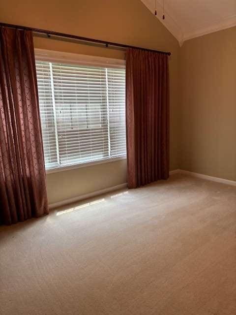 1629 Marsanne Ter, Kennesaw, GA 30152 - carpeted spare room with baseboards and vaulted ceiling