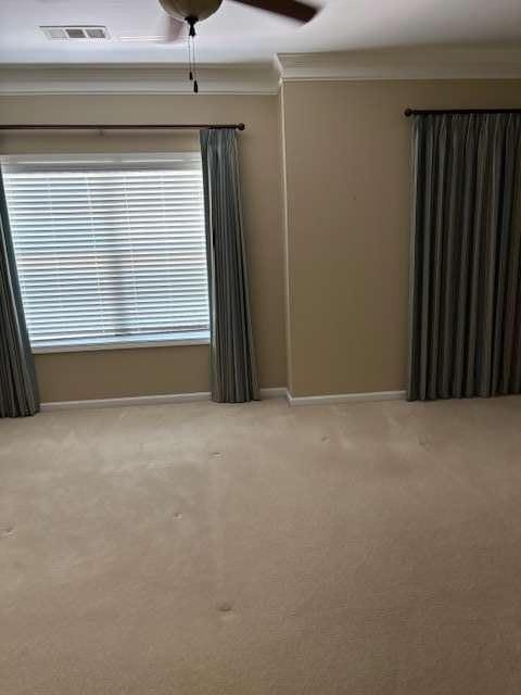 1629 Marsanne Ter, Kennesaw, GA 30152 - spare room featuring carpet floors, baseboards, and crown molding