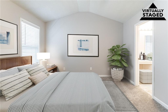 249 Bainbridge Cir, Dallas, GA 30132 - carpeted bedroom with baseboards, lofted ceiling, and ensuite bath
