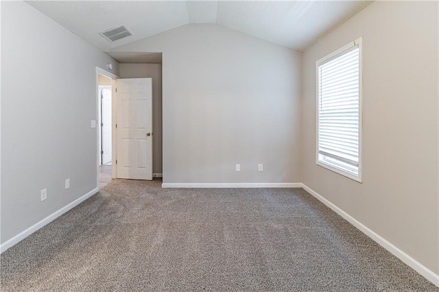 249 Bainbridge Cir, Dallas, GA 30132 - carpeted empty room featuring visible vents, a healthy amount of sunlight, baseboards, and vaulted ceiling