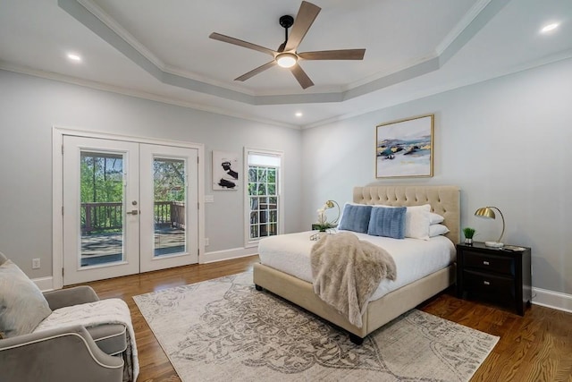 bedroom featuring french doors, access to outside, ceiling fan, and a tray ceiling