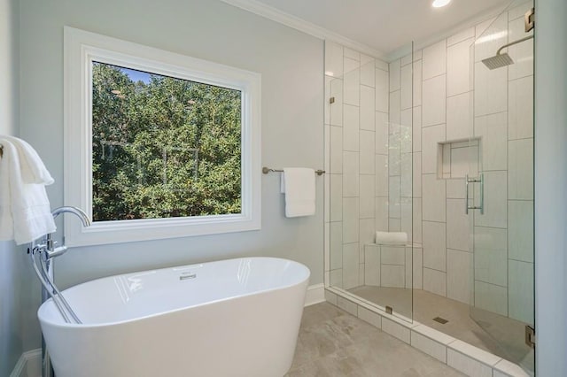 bathroom featuring independent shower and bath and ornamental molding