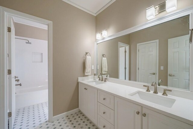 bathroom featuring crown molding and vanity