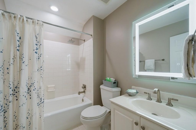 full bathroom featuring shower / bath combo with shower curtain, vanity, and toilet