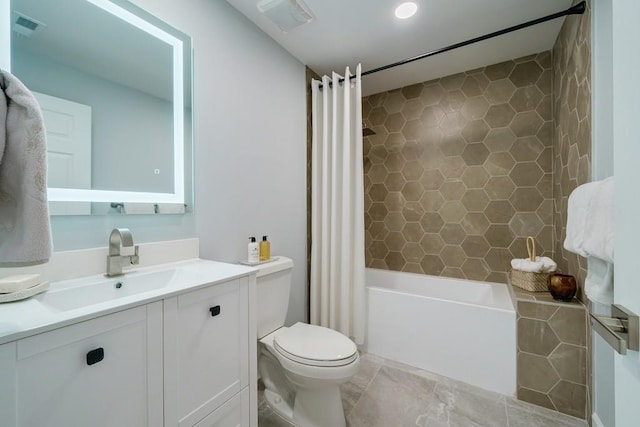 full bathroom with vanity, toilet, and shower / tub combo