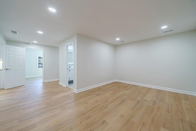 unfurnished room with light hardwood / wood-style flooring