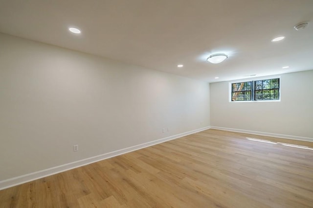 spare room with light hardwood / wood-style flooring