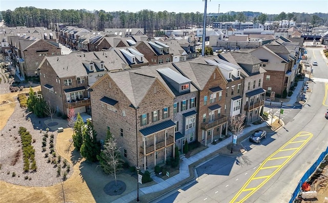 birds eye view of property with a residential view