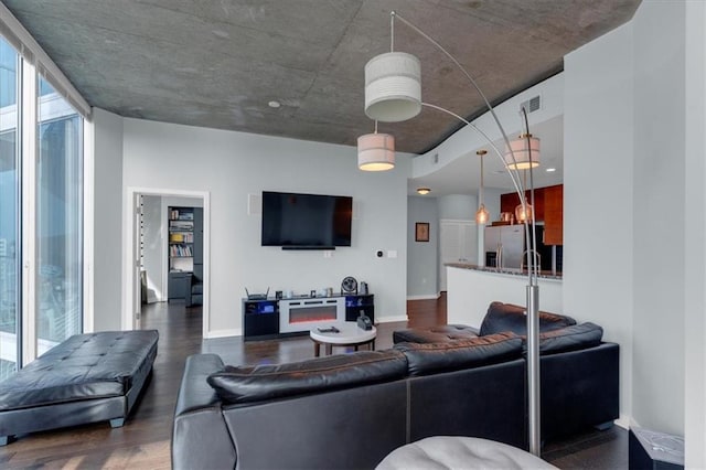 400 W Peachtree St NW Unit 2604, Atlanta, GA 30308 - living room with dark wood-style floors and baseboards