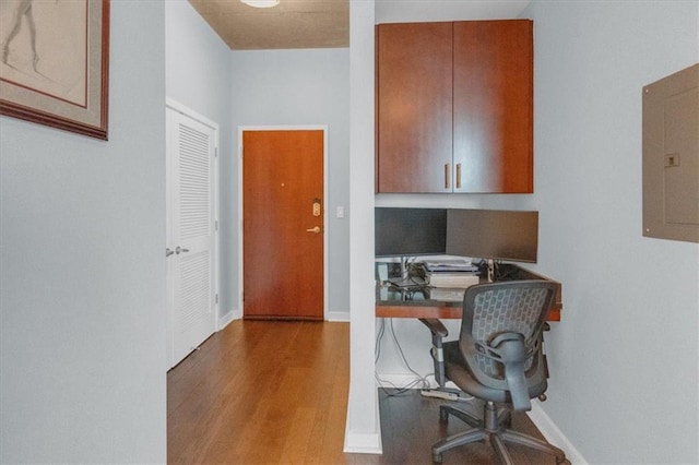 400 W Peachtree St NW Unit 2604, Atlanta, GA 30308 - office area with wood finished floors, electric panel, baseboards, and built in study area
