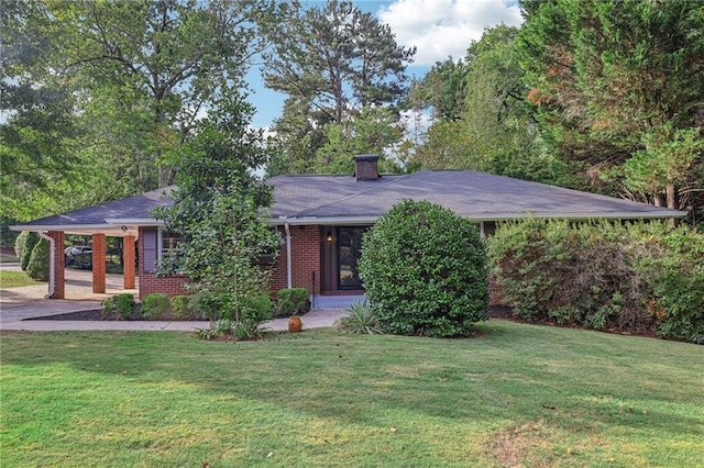 2347 Lavista Rd NE, Atlanta, GA 30329 - single story home featuring brick siding, a front yard, driveway, and a chimney