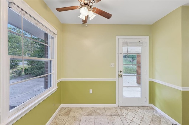 entryway with ceiling fan and a healthy amount of sunlight