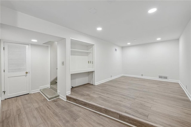 basement with light wood-type flooring