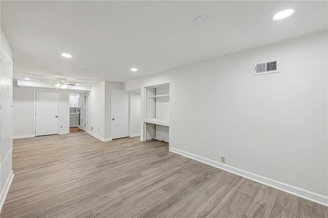 unfurnished living room featuring light hardwood / wood-style flooring and ceiling fan