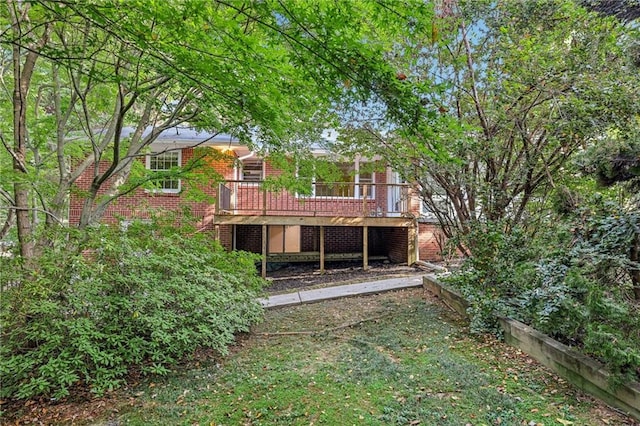 rear view of house with a wooden deck