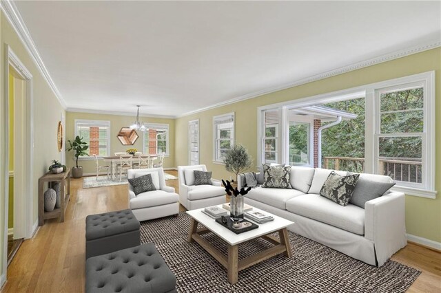 living room with light hardwood / wood-style flooring and ornamental molding