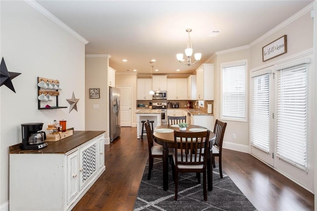 637 Little Bear Loop, Canton, GA 30114 - dining space with a chandelier, crown molding, dark wood-type flooring, and recessed lighting