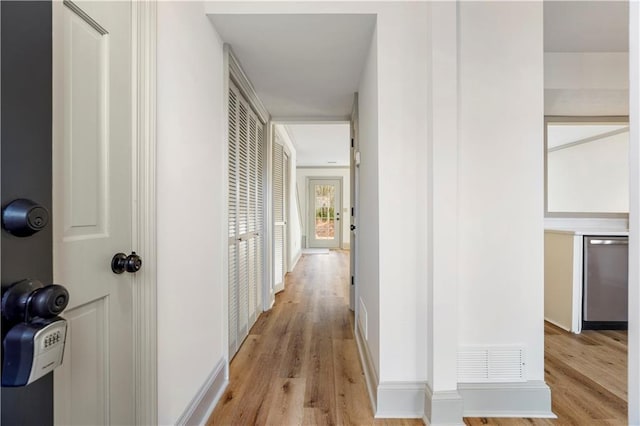 hallway featuring light hardwood / wood-style floors