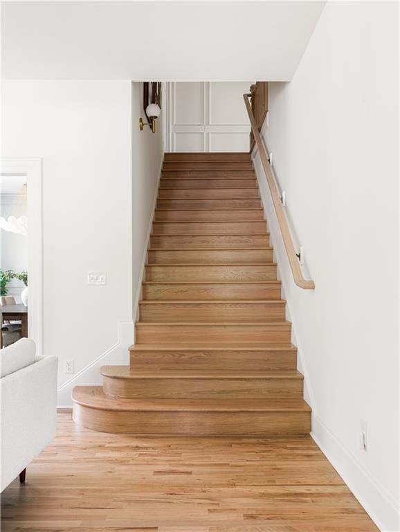 staircase with wood finished floors