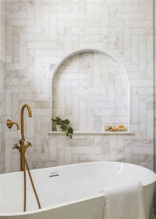 bathroom featuring a soaking tub