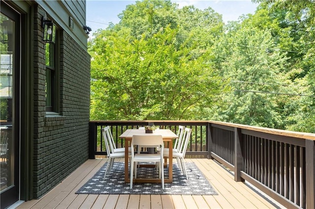 deck with outdoor dining area