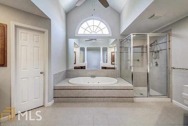 222 Chadmore Ln, Tyrone, GA 30290 - bathroom featuring a ceiling fan, a garden tub, tile patterned floors, and lofted ceiling