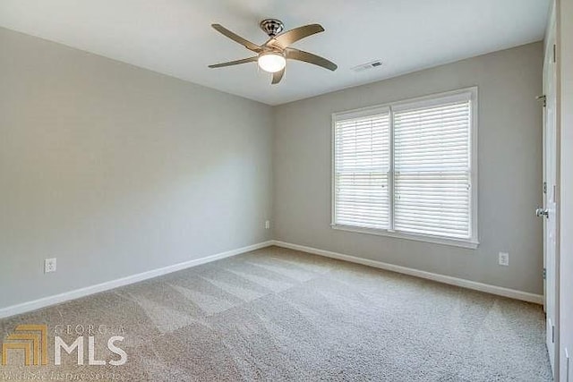 222 Chadmore Ln, Tyrone, GA 30290 - empty room featuring ceiling fan and carpet
