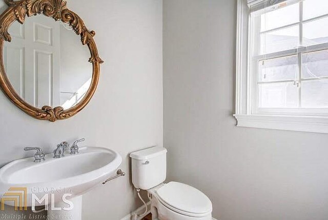 222 Chadmore Ln, Tyrone, GA 30290 - half bathroom featuring toilet and a sink