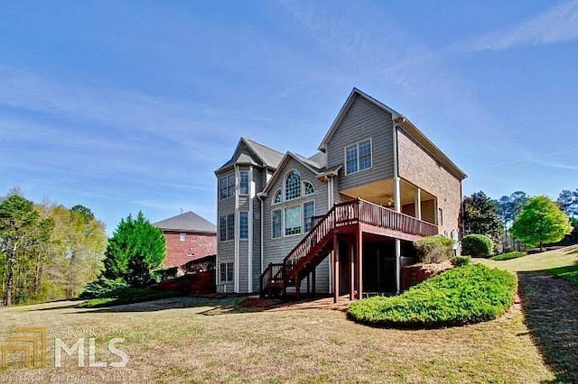 222 Chadmore Ln, Tyrone, GA 30290 - back of house featuring stairway, a deck, and a lawn