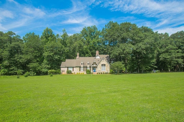 1145 Thurston Snow Rd, Good Hope, GA 30641 - view of front of house featuring a front yard, a chimney, and stone siding