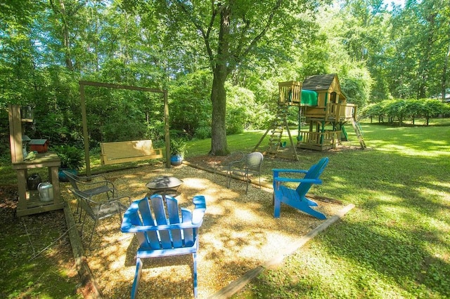 1145 Thurston Snow Rd, Good Hope, GA 30641 - view of playground with a yard and an outdoor fire pit