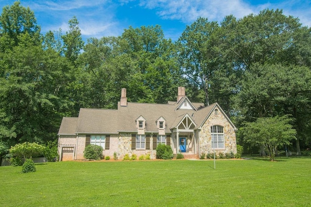 1145 Thurston Snow Rd, Good Hope, GA 30641 - tudor-style house featuring stone siding, a front yard, and a chimney