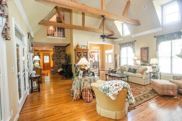 1145 Thurston Snow Rd, Good Hope, GA 30641 - living room featuring high vaulted ceiling, light wood-style floors, healthy amount of natural light, beam ceiling, and a chandelier