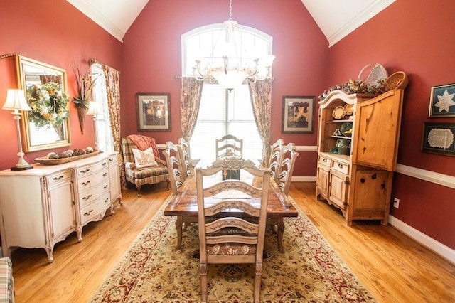 1145 Thurston Snow Rd, Good Hope, GA 30641 - dining area with crown molding, a chandelier, light wood-type flooring, and high vaulted ceiling
