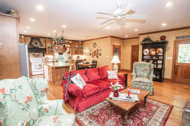 1145 Thurston Snow Rd, Good Hope, GA 30641 - living room featuring recessed lighting, ceiling fan, ornamental molding, light wood-type flooring, and a chandelier