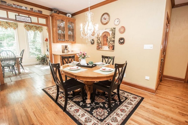 1145 Thurston Snow Rd, Good Hope, GA 30641 - dining room with a chandelier, crown molding, and light wood-type flooring