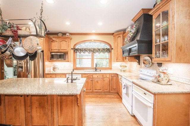 1145 Thurston Snow Rd, Good Hope, GA 30641 - kitchen featuring stainless steel appliances, light wood-style flooring, light stone countertops, glass insert cabinets, and recessed lighting