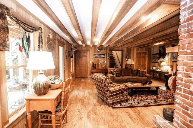 1145 Thurston Snow Rd, Good Hope, GA 30641 - living room with stairs, wood finished floors, wood walls, and beam ceiling