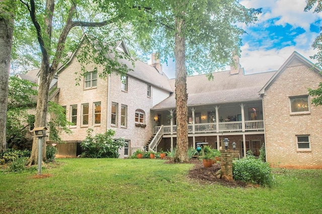 1145 Thurston Snow Rd, Good Hope, GA 30641 - rear view of property featuring a yard, brick siding, stairs, and a chimney