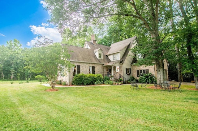 1145 Thurston Snow Rd, Good Hope, GA 30641 - view of front of house featuring a front lawn, brick siding, and a chimney