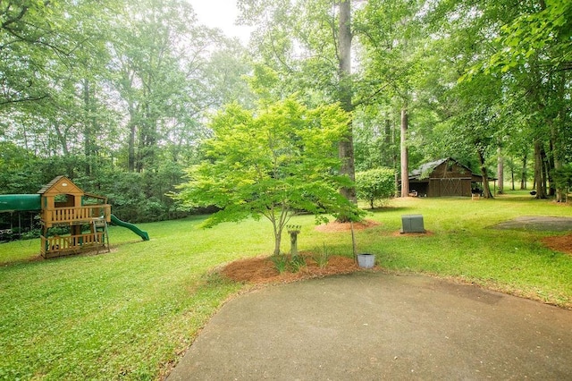 1145 Thurston Snow Rd, Good Hope, GA 30641 - view of grassy yard featuring a playground
