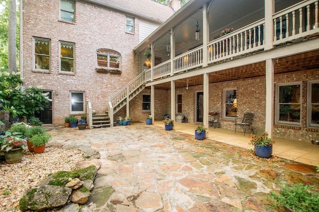 1145 Thurston Snow Rd, Good Hope, GA 30641 - back of house featuring stairway, a patio area, and brick siding