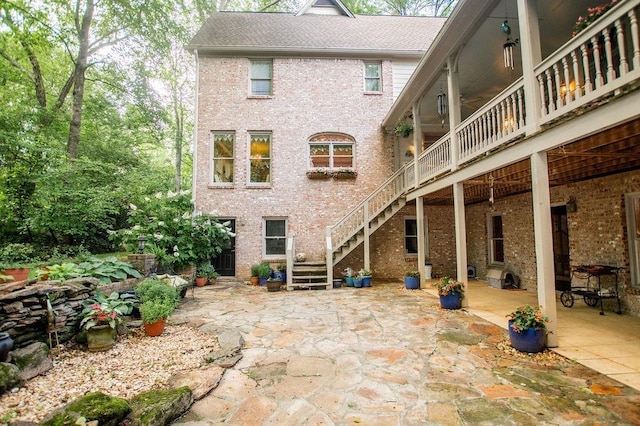 1145 Thurston Snow Rd, Good Hope, GA 30641 - back of house with stairway, a patio, brick siding, and roof with shingles