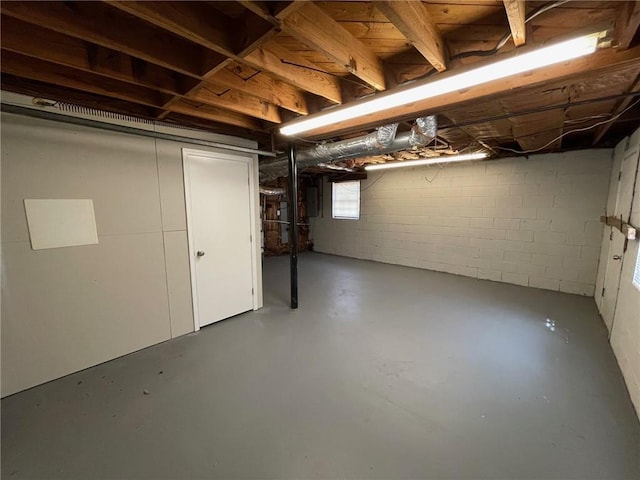 basement featuring electric panel